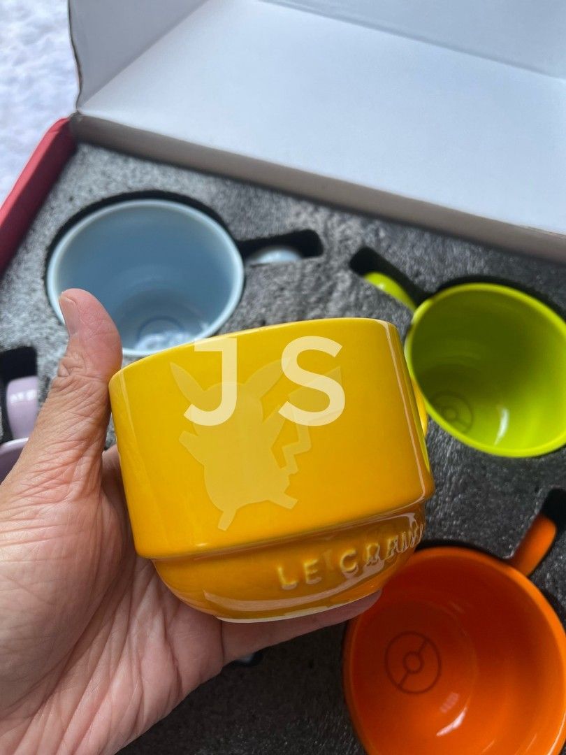 Le Creuset x Pokemon Mug Set (Category: Coffee & Tea Tableware) located in Quezon City. Submitted by jiglieshop (Listing ID 1437090046, Image 3). Description: - Le Creuset Pokemon Mug Set - Includes 5 mugs in various colors: yellow, blue, purple, green, and orange - Each mug features a unique Pokemon design - Comes with a special Pokemon-themed box.