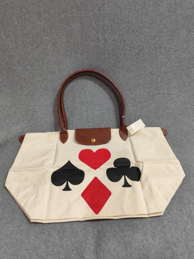 Longchamp Le Pliage Large Long Handle - Playing Cards (Category: Luxury Bags & Wallets) located in Quezon City. Submitted by venchar (Listing ID 1437209728, Image 1). Description: - Authentic Longchamp Le Pliage tote bag - Unique playing card design - Brown leather handles - Secure flap closure - Zipper and snap closures - Spacious and clean interior - Includes original tag - brand New - never been use .