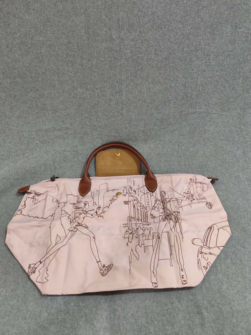 Longchamp Limited Ed. Bandee Dessinee Medium Short Handle (Category: Luxury Bags & Wallets) located in Quezon City. Submitted by venchar (Listing ID 1437209902, Image 3). Description: - Authentic Longchamp Le Pliage handbag - Unique design with old rose body and black outline illustration - Brown leather handles and flap closure - Gold-colored button detail - Secure zipper closure - Foldable design for easy storage - brand new - never been use.