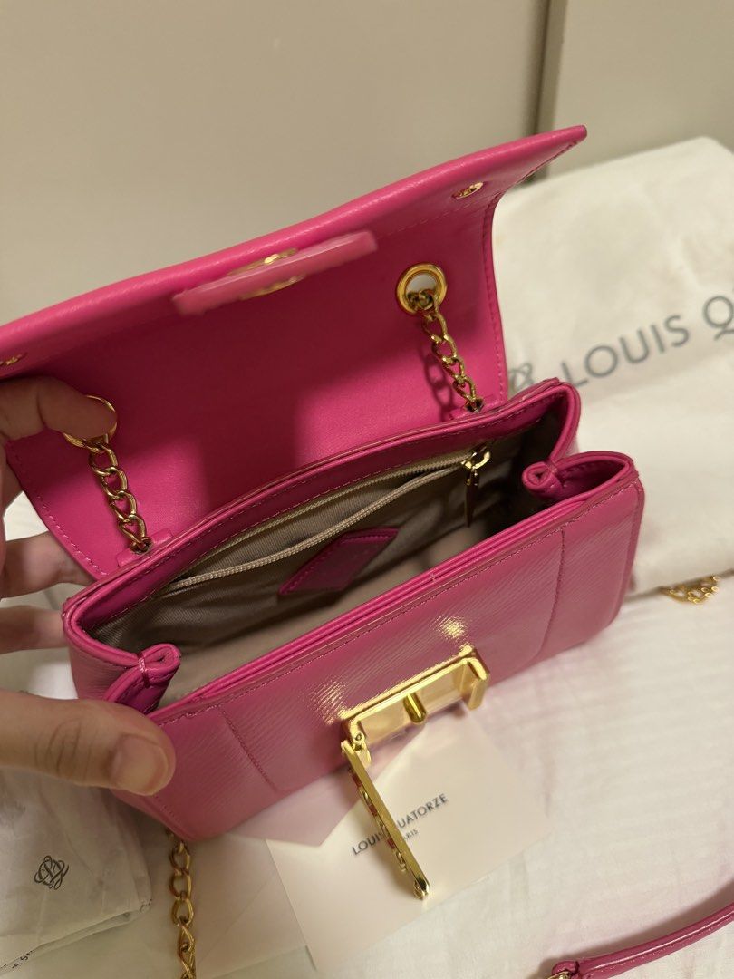 Louis Quatorze Pink Shoulder Bag (Category: Shoulder Bags) located in Tarlac. Submitted by never.wearing (Listing ID 1437125144, Image 3). Description: - Authentic Louis Quatorze shoulder bag - Vibrant pink color - Gold chain strap - Gold-tone clasp with logo - Includes dust bag and card - Lined interior with small pocket.
