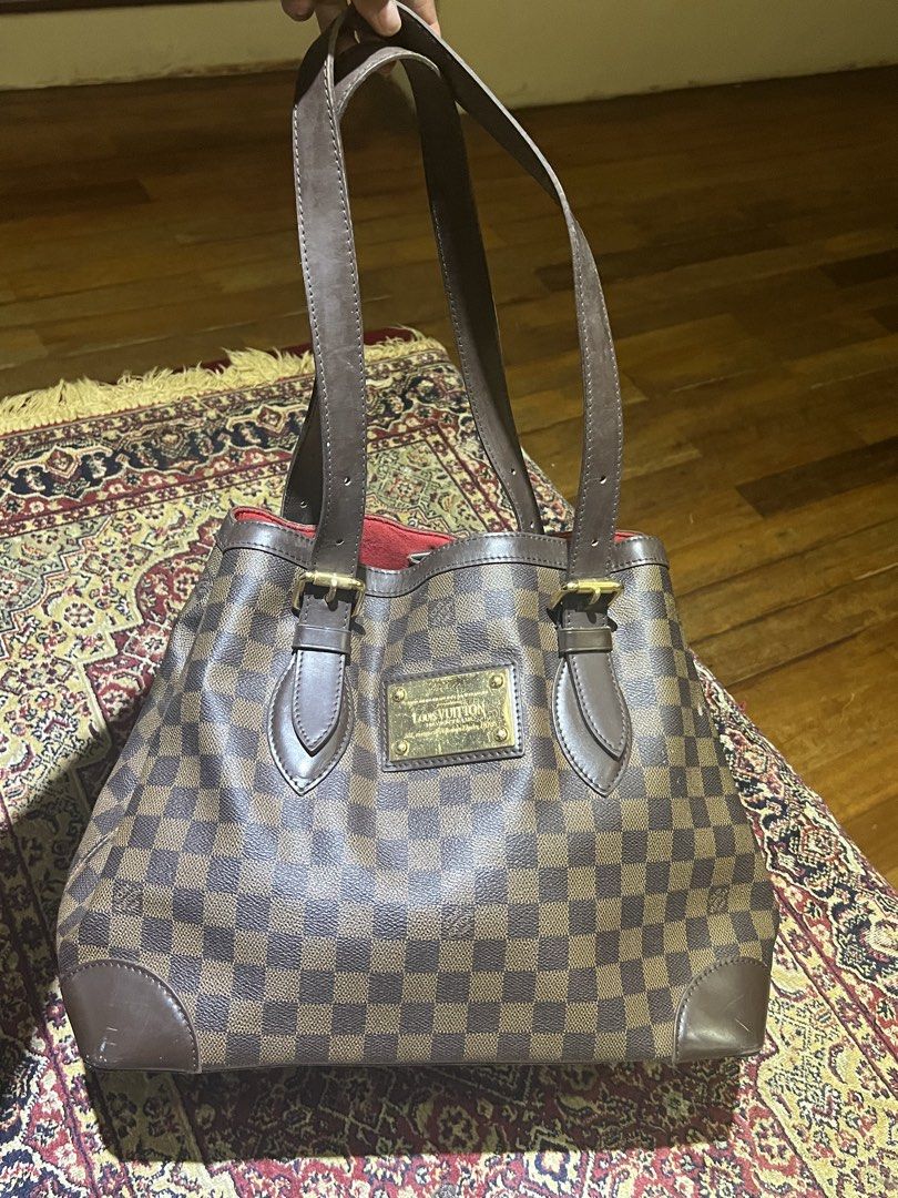 Louis Vuitton Damier (Category: Luxury Bags & Wallets) located in Cagayan de Oro. Submitted by chandythegreat (Listing ID 1437149038, Image 1). Description: This is a pre-owned Louis Vuitton Damier Ebene Hampstead MM tote bag featuring a checkered brown canvas body, brown leather straps, and a gold-tone "Louis Vuitton Inventeur" plaque on the front. 100% Original bought it around 70k selling it for 40k No issue minimal sign of use only super kapa