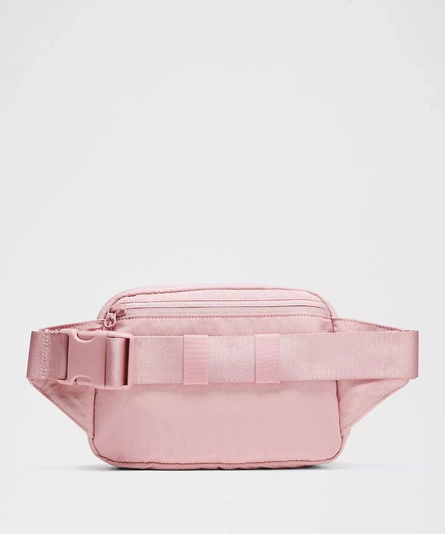 Lululemon Everywhere 2L Belt Bag - Pink (Category: Cross-body Bags) located in Mandaluyong City. Submitted by dainxxx (Listing ID 1437186561, Image 2). Description: - Lululemon Everywhere Belt Bag - Stylish and practical design - Zippered main compartment - Adjustable strap for a comfortable fit - Exterior pocket for easy access - Sleek, minimalist aesthetic - Perfect for carrying essentials - Color: Light pink.