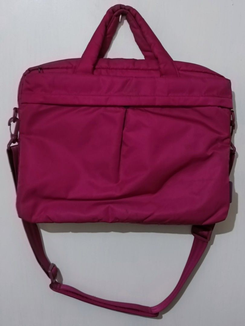 Laptop Bag with Shoulder Strap (Category: Laptop Bags & Sleeves) located in Manila. Submitted by greatbrandsforless (Listing ID 1437029834, Image 1). Description: - Pink laptop bag - Top handle and detachable shoulder strap - Front pocket - Zipper closure - Durable, possibly water-resistant material - Suitable for laptops and essentials - Solid color, simple design.