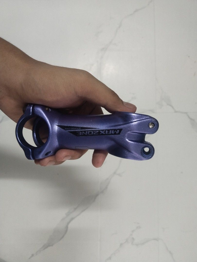 MAXZONE Bike Stem (Category: Bicycles) located in Taguig. Submitted by mvthrifts (Listing ID 1437091906, Image 3). Description: - Brand: MAXZONE - Color: Blue - Material: Alloy - Design: Standard stem with handlebar and steerer tube clamps - Compatibility: Mountain bikes and road bikes - Features: MAXZONE logo Taguig Loc.