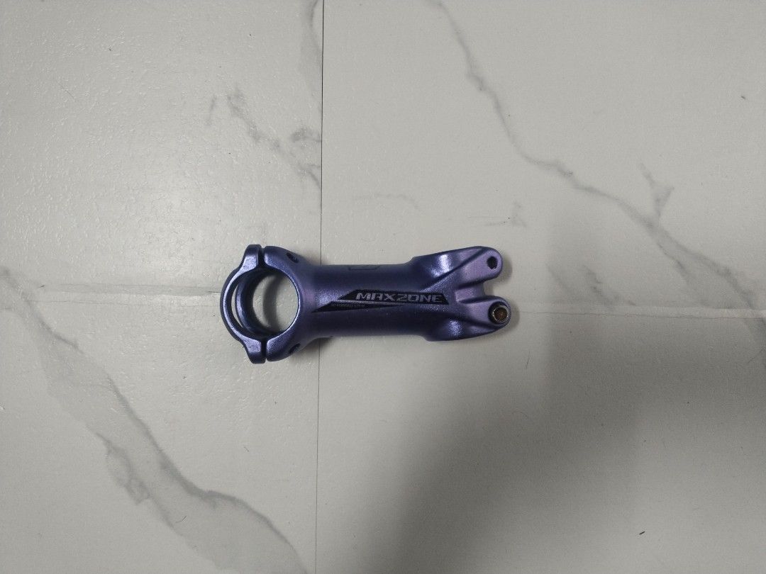 MAXZONE Bike Stem (Category: Bicycles) located in Taguig. Submitted by mvthrifts (Listing ID 1437091906, Image 2). Description: - Brand: MAXZONE - Color: Blue - Material: Alloy - Design: Standard stem with handlebar and steerer tube clamps - Compatibility: Mountain bikes and road bikes - Features: MAXZONE logo Taguig Loc.