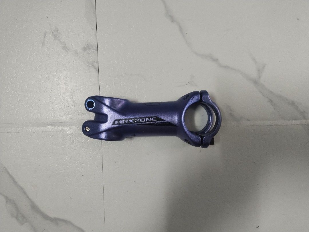 MAXZONE Bike Stem (Category: Bicycles) located in Taguig. Submitted by mvthrifts (Listing ID 1437091906, Image 1). Description: - Brand: MAXZONE - Color: Blue - Material: Alloy - Design: Standard stem with handlebar and steerer tube clamps - Compatibility: Mountain bikes and road bikes - Features: MAXZONE logo Taguig Loc.