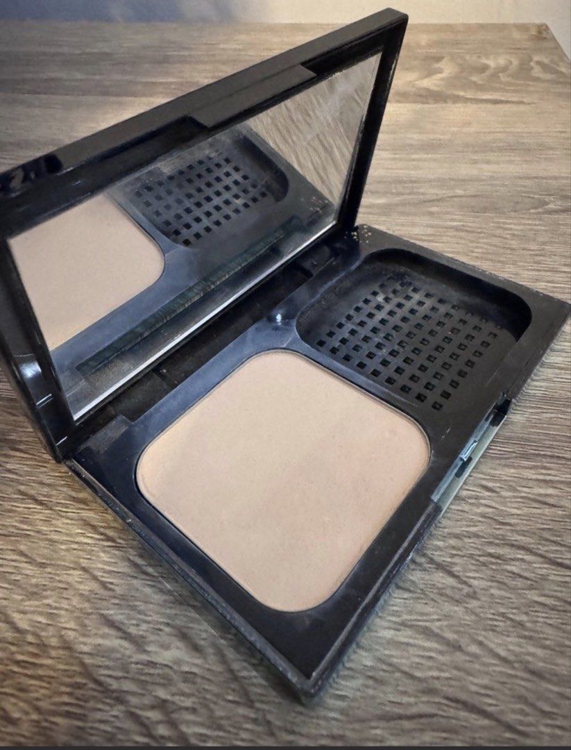 Maybelline Fit Me Powder (Category: Makeup) located in Manila. Submitted by decluterthings888 (Listing ID 1437202518, Image 1). Description: - Maybelline Fit Me powder compact - Light beige shade - Includes mirror - Features a compartment for sponge/applicator - Black compact with white and blue Fit Me logo - Maybelline New York logo visible.