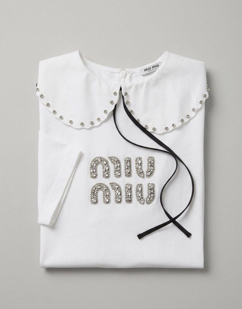 ▪️Miu Miu w/rhinestone White Tee Shirt (Category: Luxury Apparel) located in Makati City. Submitted by aveltot_rig (Listing ID 1436095551, Image 2). Description: Item: Miu Miu w/rhinestone White Tee Shirt Dimes: width: 21 x length: 26 📏 Condition: good condition only! ✨issue last photo.