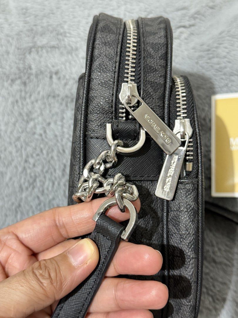 MK sling bag (Category: Luxury Bags & Wallets) located in San Jose. Submitted by next.2.love (Listing ID 1437125486, Image 2). Description: Rarely used Michael Kors sling. With minor oxidation on one buckle and barely noticeable peeling on the lining. Still in very good condition. No bottom rubs. .