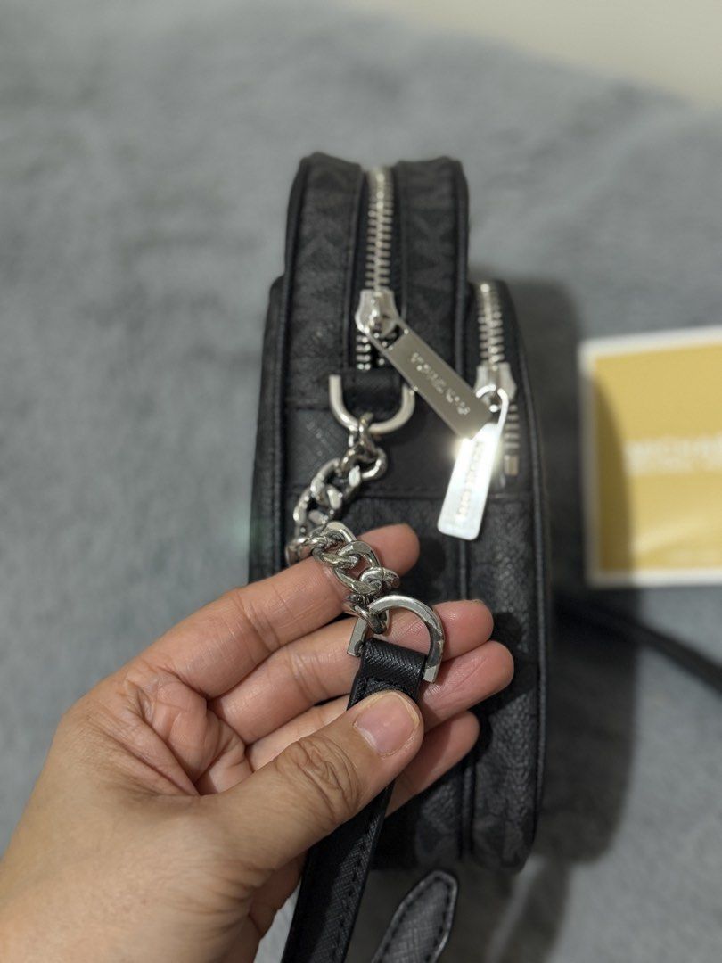 MK sling bag (Category: Luxury Bags & Wallets) located in San Jose. Submitted by next.2.love (Listing ID 1437125486, Image 3). Description: Rarely used Michael Kors sling. With minor oxidation on one buckle and barely noticeable peeling on the lining. Still in very good condition. No bottom rubs. .