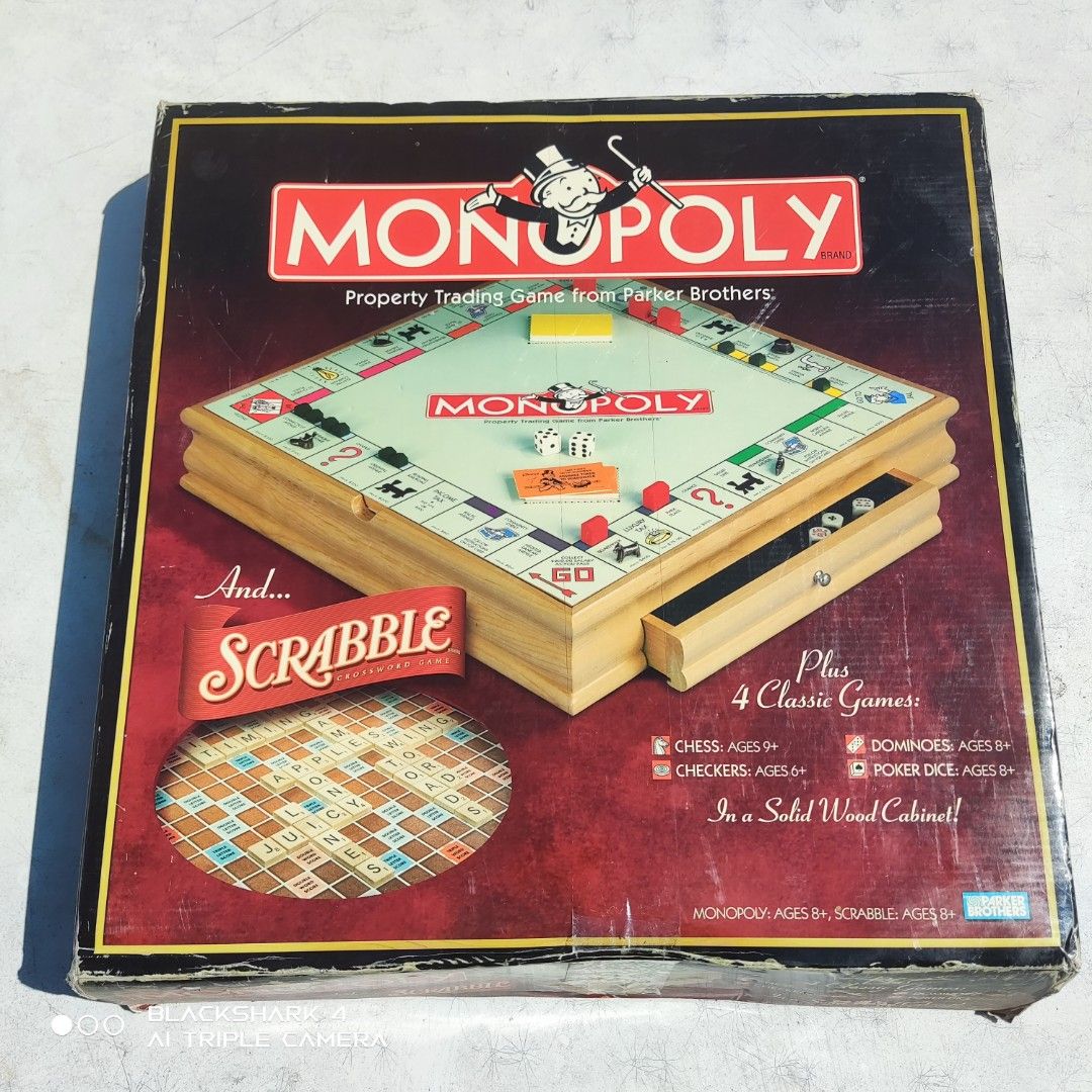 Monopoly and Scrabble Board Game Set (Category: Board Games & Puzzles) located in Bugallon. Submitted by ariel013 (Listing ID 1437054569, Image 1). Description: - Includes Monopoly, Scrabble, Chess, Checkers, Dominoes, and Poker Dice - Solid wood cabinet - Contains game boards, pieces, dice, and accessories - Great for family game nights and gatherings.