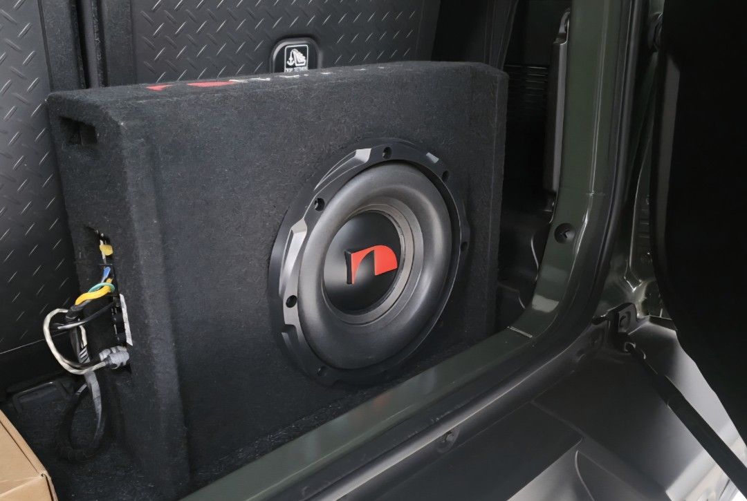 Perfect fit for Suzuki Jimny (Category: Audio, Video, Alarm and other Electronic Accessories) located in Taguig. Submitted by RJR888 (Listing ID 1437086984, Image 2). Description: - Nakamichi car subwoofer - Black color - Features a red Nakamichi logo - Single, large speaker - Rectangular box design - Covered in black fabric No more box.