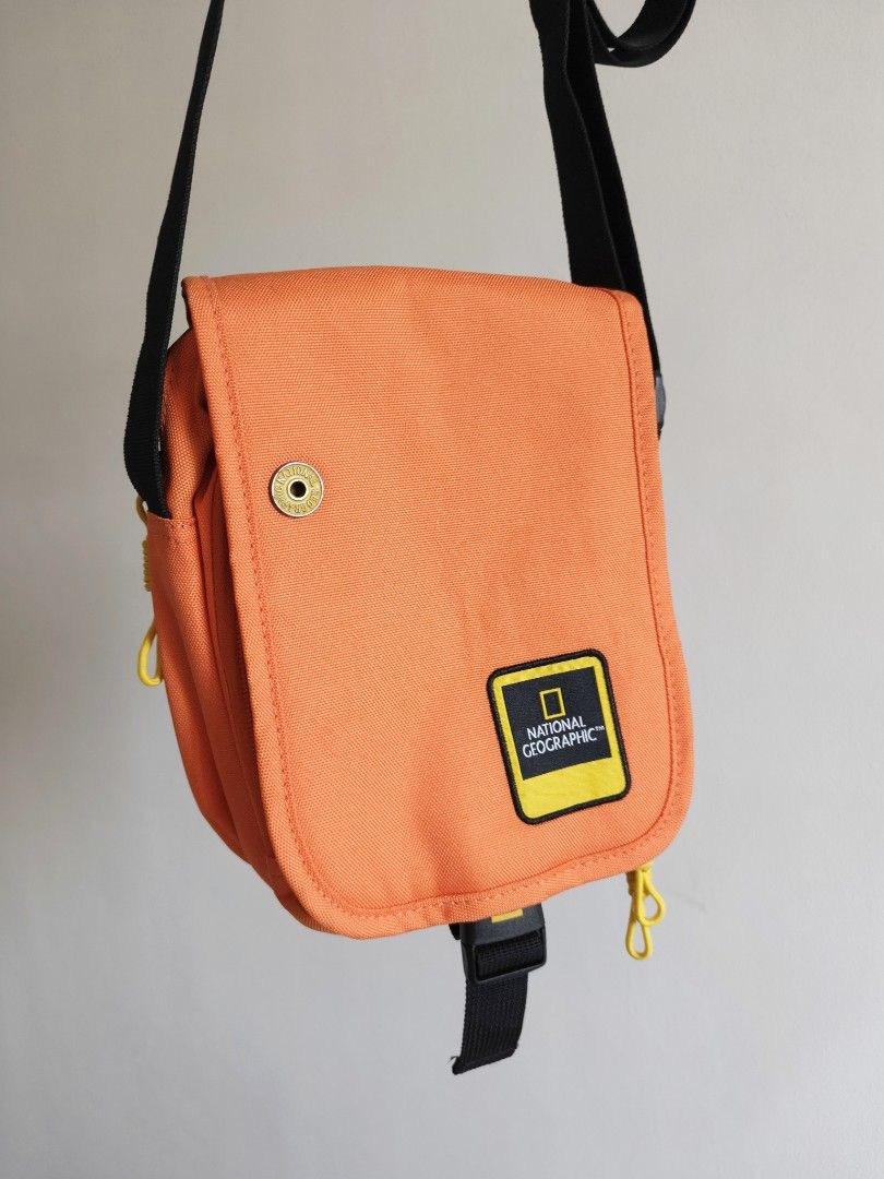 National Geographic Orange Sling Bag (Category: Sling Bags) located in Bulacan. Submitted by starterpackph (Listing ID 1437181905, Image 1). Description: BOUGHT - NOVEMBER 14 2025 SOLD - MAY 4 2026 National Geographic Sling bag 499 Php Only -Like new condition -Orange in color -Dual compartment 🚸 No meet ups 📦 Delivery via J&T or LBC 💳 Payment first via Gcash.