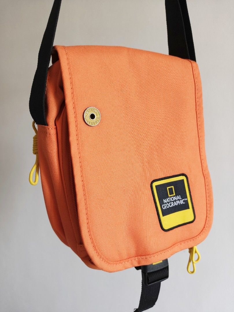 National Geographic Orange Sling Bag (Category: Sling Bags) located in Bulacan. Submitted by starterpackph (Listing ID 1437181905, Image 2). Description: BOUGHT - NOVEMBER 14 2025 SOLD - MAY 4 2026 National Geographic Sling bag 499 Php Only -Like new condition -Orange in color -Dual compartment 🚸 No meet ups 📦 Delivery via J&T or LBC 💳 Payment first via Gcash.