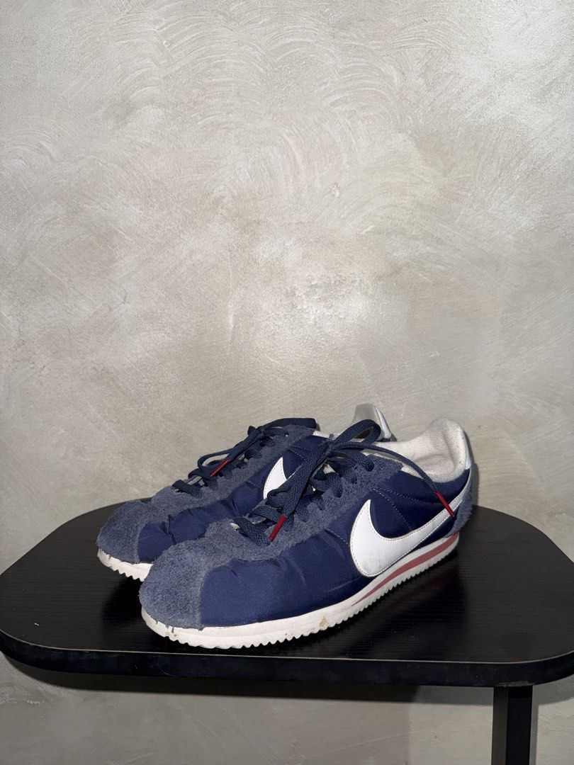 Nike Cortez Navy Blue Sneakers (Category: Sneakers) located in Mandaluyong City. Submitted by markqzn2 (Listing ID 1437114565, Image 1). Description: - Nike Cortez sneakers - Navy blue with white swoosh and red accents - Size: US 9.5, UK 8.5, EUR 43, 27.5 cm - Made in Indonesia - Signs of wear on soles and uppers - Manufacturing date: 08/03/16.