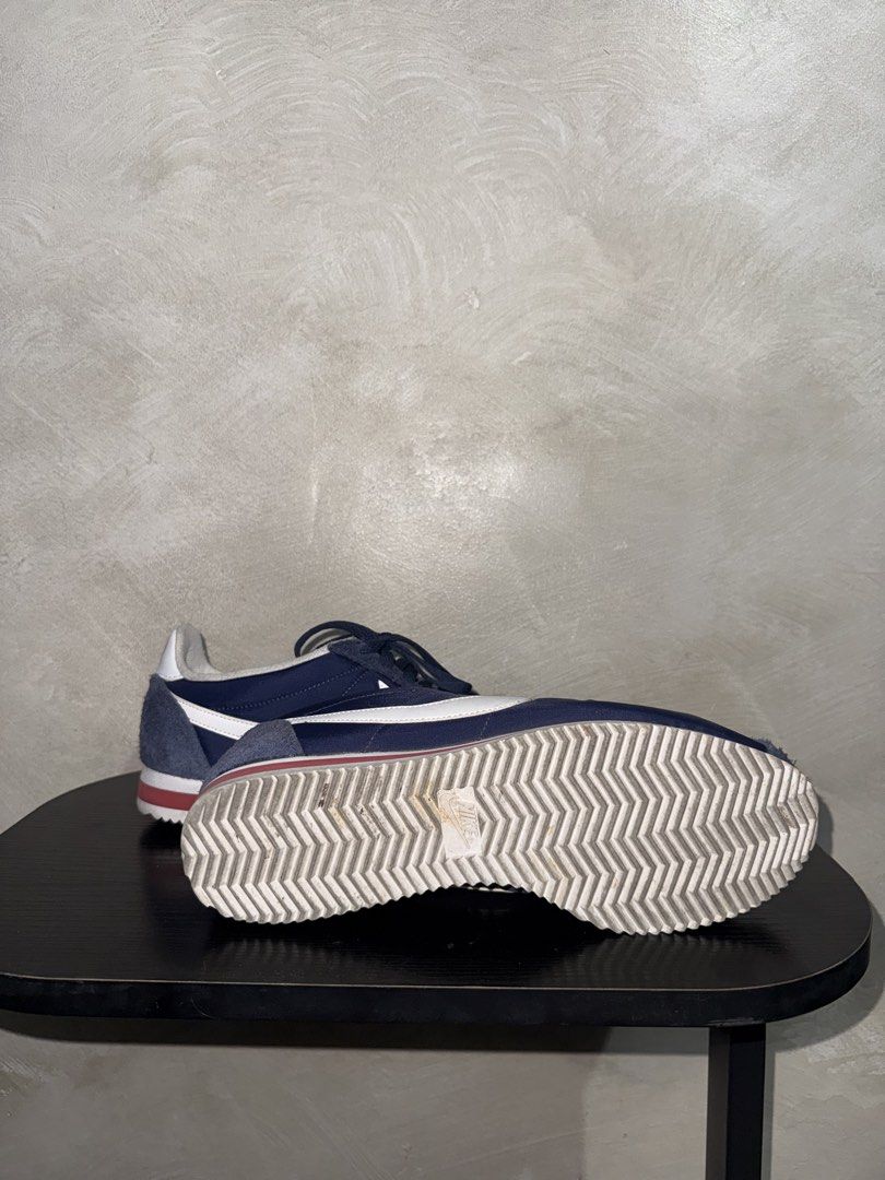 Nike Cortez Navy Blue Sneakers (Category: Sneakers) located in Mandaluyong City. Submitted by markqzn2 (Listing ID 1437114565, Image 3). Description: - Nike Cortez sneakers - Navy blue with white swoosh and red accents - Size: US 9.5, UK 8.5, EUR 43, 27.5 cm - Made in Indonesia - Signs of wear on soles and uppers - Manufacturing date: 08/03/16.