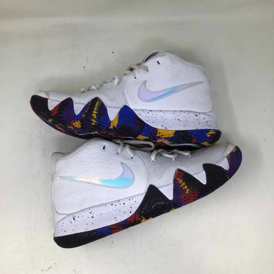 Nike Kyrie 4 'NCAA Tournement' (Category: Sneakers) located in Kuala Lumpur. Submitted by elminasrun (Listing ID 1437199461, Image 1). Description: White Nike Kyrie 4 sneakers with a unique multicolor outsole. Features a white upper with a textured pattern and iridescent Nike swoosh. The midsole has a speckled design. Perfect for basketball or casual wear..