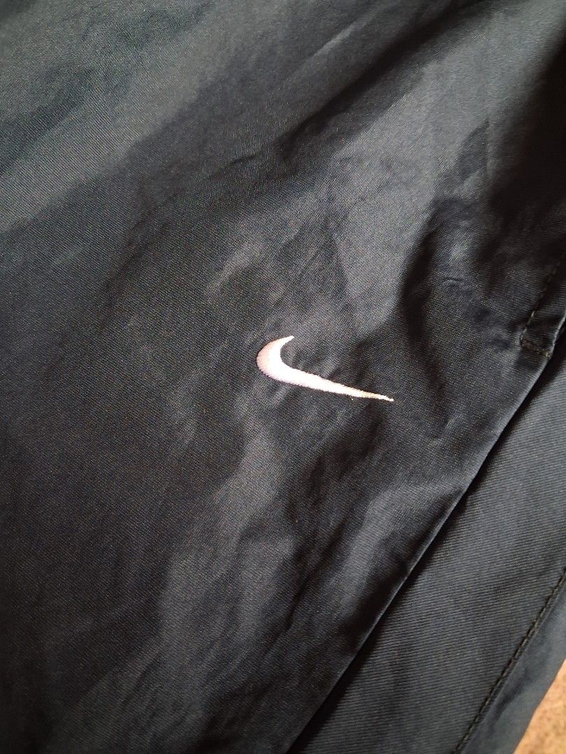 Nike trackpants with embroidered white swoosh (Category: Activewear) located in Giporlos. Submitted by berniee21 (Listing ID 1437036639, Image 2). Description: 480 shipped nalang to asnew condition pinhole sa likod just below the knee maliit lang.