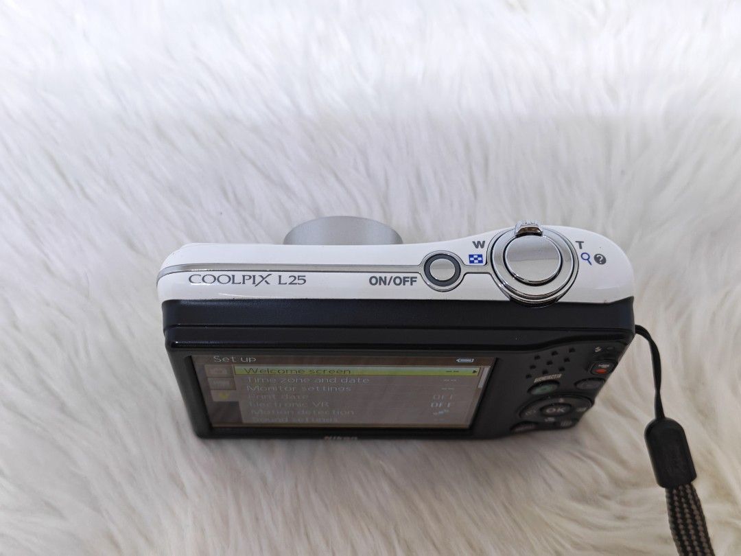 Nikon COOLPIX L25 Digital Camera (Category: Cameras) located in Manila. Submitted by ultimogizmos (Listing ID 1437077884, Image 3). Description: - Nikon COOLPIX L25 digital camera - 10 megapixels - Built-in flash - Zoom lens - Black and white design - Setup menu for time, date, and other settings excellent working conditions no issues actual and sample pics posted last price umit with memory uses 2 double a battery not included - Includes wrist s