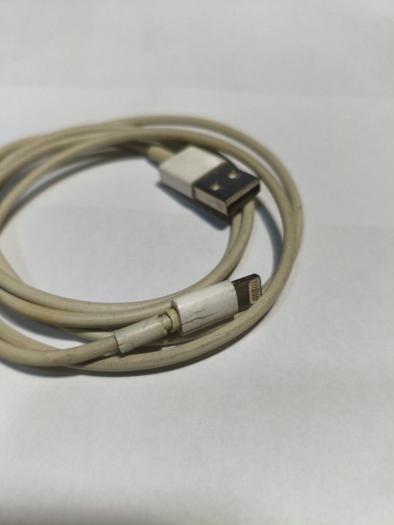 Original Apple Lightning to USB Cable (Category: Chargers & Cables) located in Pasig City. Submitted by coolphoenix-29ac (Listing ID 1437157386, Image 2). Description: - Authentic Apple Lightning to USB cable - Color: White - Standard charging cable for Apple devices - USB-A to Lightning connectors - Coiled and ready for use.