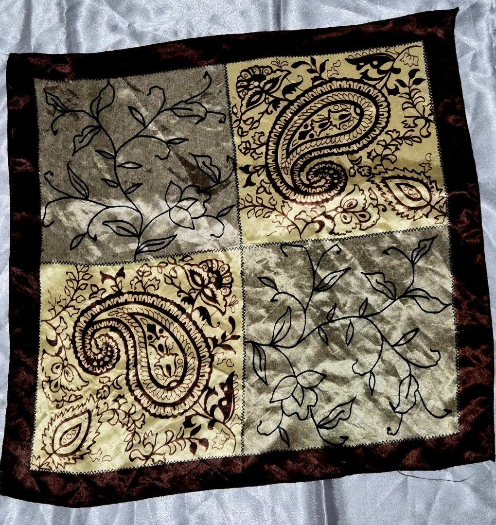Paisley Pattern Table Runner 20 x 20 inches (Category: Table Linen & Textiles) located in Mandaue City. Submitted by chuchi152615 (Listing ID 1437020971, Image 1). Description: - Square table runner - Features paisley and floral designs - Color scheme: Brown and gold with a dark brown border - Made of silky material - Dimensions: Approximately 20 inches x 20 inches.