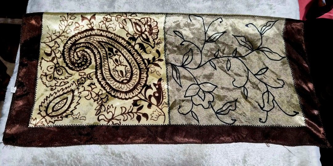 Paisley Pattern Table Runner 20 x 20 inches (Category: Table Linen & Textiles) located in Mandaue City. Submitted by chuchi152615 (Listing ID 1437020971, Image 3). Description: - Square table runner - Features paisley and floral designs - Color scheme: Brown and gold with a dark brown border - Made of silky material - Dimensions: Approximately 20 inches x 20 inches.