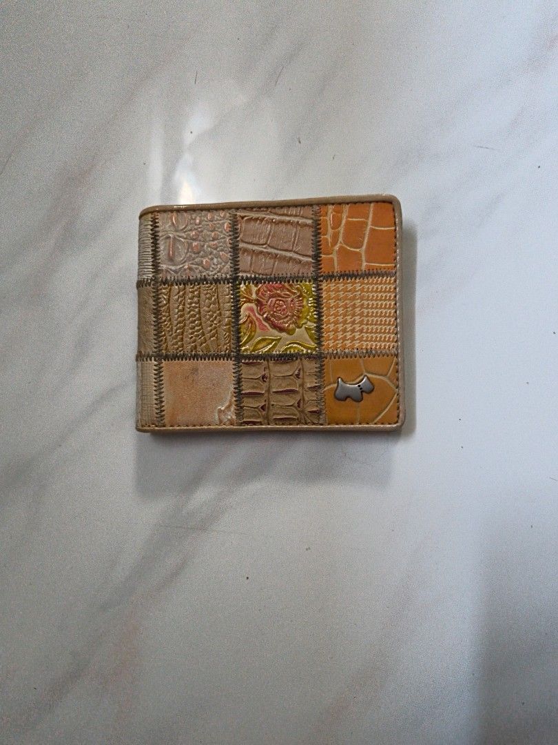 Patchwork Wallet (Category: Wallets & Card Holders) located in Singapore. Submitted by fern.8y428b (Listing ID 1437060327, Image 2). Description: - Unique patchwork leather design - Multiple compartments - Includes card slots - Features a zippered pocket - Light beige interior - Brand logo visible - Stylish and functional.