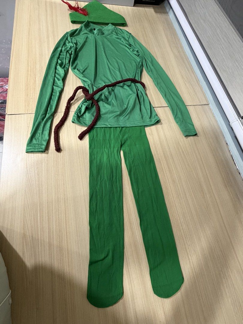 Peter Pan Costume Set (Category: Babies & Kids Fashion) located in Mandaluyong City. Submitted by jpc0708 (Listing ID 1437135942, Image 1). Description: - Green Peter Pan costume set - Includes: - Long-sleeved top - Pants - Hat - Brown rope belt - Top measurements: 24" length, 14" across - Pants measurements: 26" length, 7" waist - Perfect for costume parties and themed events.