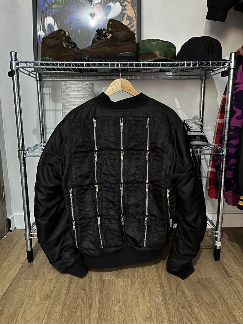 Phenomenon Reversible Bomber Jacket (Category: Coats, Jackets and Outerwear) located in Pasay City. Submitted by synag (Listing ID 1437204812, Image 1). Description: - Phenomenon Japan Brand reversible bomber jacket - Black exterior with multiple zippers on the back - Bright orange interior - Classic bomber design - Size L .