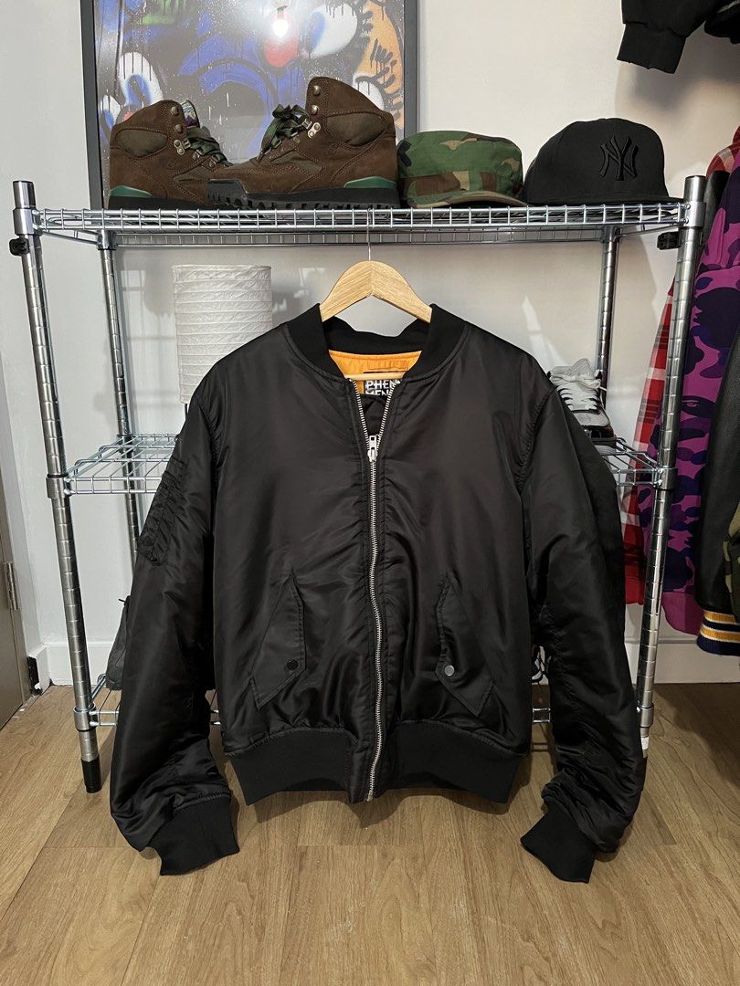 Phenomenon Reversible Bomber Jacket (Category: Coats, Jackets and Outerwear) located in Pasay City. Submitted by synag (Listing ID 1437204812, Image 2). Description: - Phenomenon Japan Brand reversible bomber jacket - Black exterior with multiple zippers on the back - Bright orange interior - Classic bomber design - Size L .