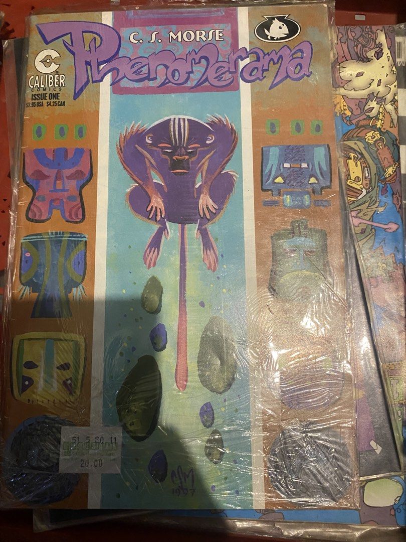 PhenoZorama Issue One Comic Book (Category: Comics & Manga) located in Marikina City. Submitted by jtv17 (Listing ID 1437018180, Image 1). Description: - PhenoZorama Issue One comic book - Artwork by C.S. Morse - Published by Caliber - Sealed in plastic - Price tag: 20.00 - Dated 1997 - Cover art: Purple creature with a long tail.