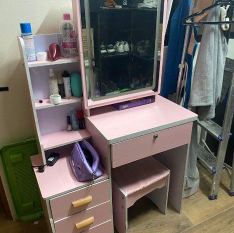 Pinky Vanity Table with Mirror and Mini Chair (Category: Tables & Sets) located in Las Pinas. Submitted by gorgeouslayph (Listing ID 1437042757, Image 1). Description: - Pink vanity table - Built-in mirror with lights - Includes a small stool - Multiple drawers for storage - Side shelf for beauty products - Clean design with light pink finish and wooden accents - Perfect for bedroom or dressing area.