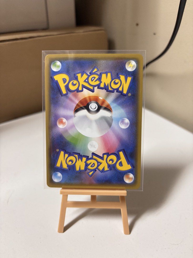 Pokemon Reshiram 25th Anniversary Card (Category: Raw Singles) located in Pasay City. Submitted by tindeclutterstuff (Listing ID 1437182977, Image 2). Description: - Pokemon Reshiram card - From the 25th Anniversary collection - Features detailed Reshiram illustration - Japanese text - Comes in a protective sleeve - Card displayed on a small easel - Comes with a protective sleeve #pokemon #pokemoncards #cards #tcg .
