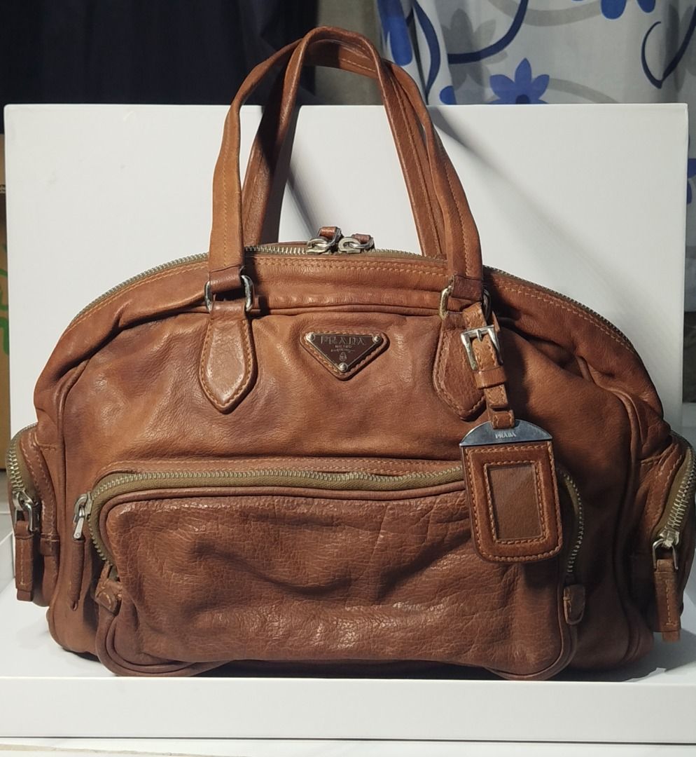 Pre-loved PRADA Brown Leather Boston Bag (Category: Luxury Bags & Wallets) located in Caloocan City. Submitted by maxine.03 (Listing ID 1437133926, Image 1). Description: Price is negotiable for sure buyer! In very good condition, barely used. Send me a message for more details. MOP: Gcash or Online Banking MOD: LBC.