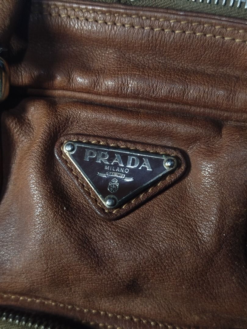 Pre-loved PRADA Brown Leather Boston Bag (Category: Luxury Bags & Wallets) located in Caloocan City. Submitted by maxine.03 (Listing ID 1437133926, Image 2). Description: Price is negotiable for sure buyer! In very good condition, barely used. Send me a message for more details. MOP: Gcash or Online Banking MOD: LBC.