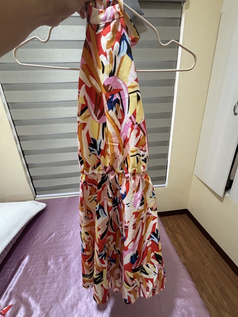 Printed Halter Neck Backless Dress (Category: Dresses) located in Las Pinas. Submitted by drecessionista (Listing ID 1437059410, Image 1). Description: - Abstract print halter neck dress - Features an elasticated waist - Flowing skirt design - Includes a matching fabric belt - Color scheme: red, yellow, and orange - Ideal for casual occasions.