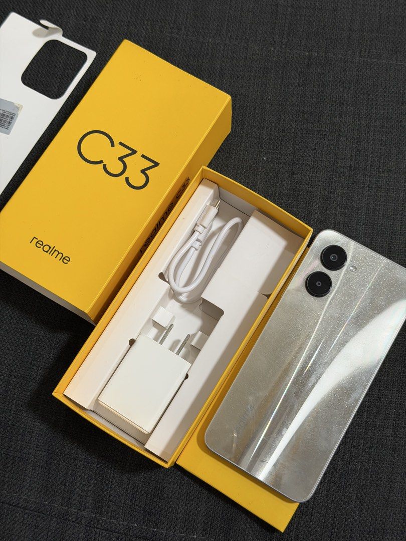 realme c33 (Category: Realme) located in Makati City. Submitted by bloggerrific (Listing ID 1437179263, Image 2). Description: realme c33. Sandy Gold. No issue. Almost new Complete box. Small cable and charger. Used by my mom for couple of months (Just facebook and messenger)..