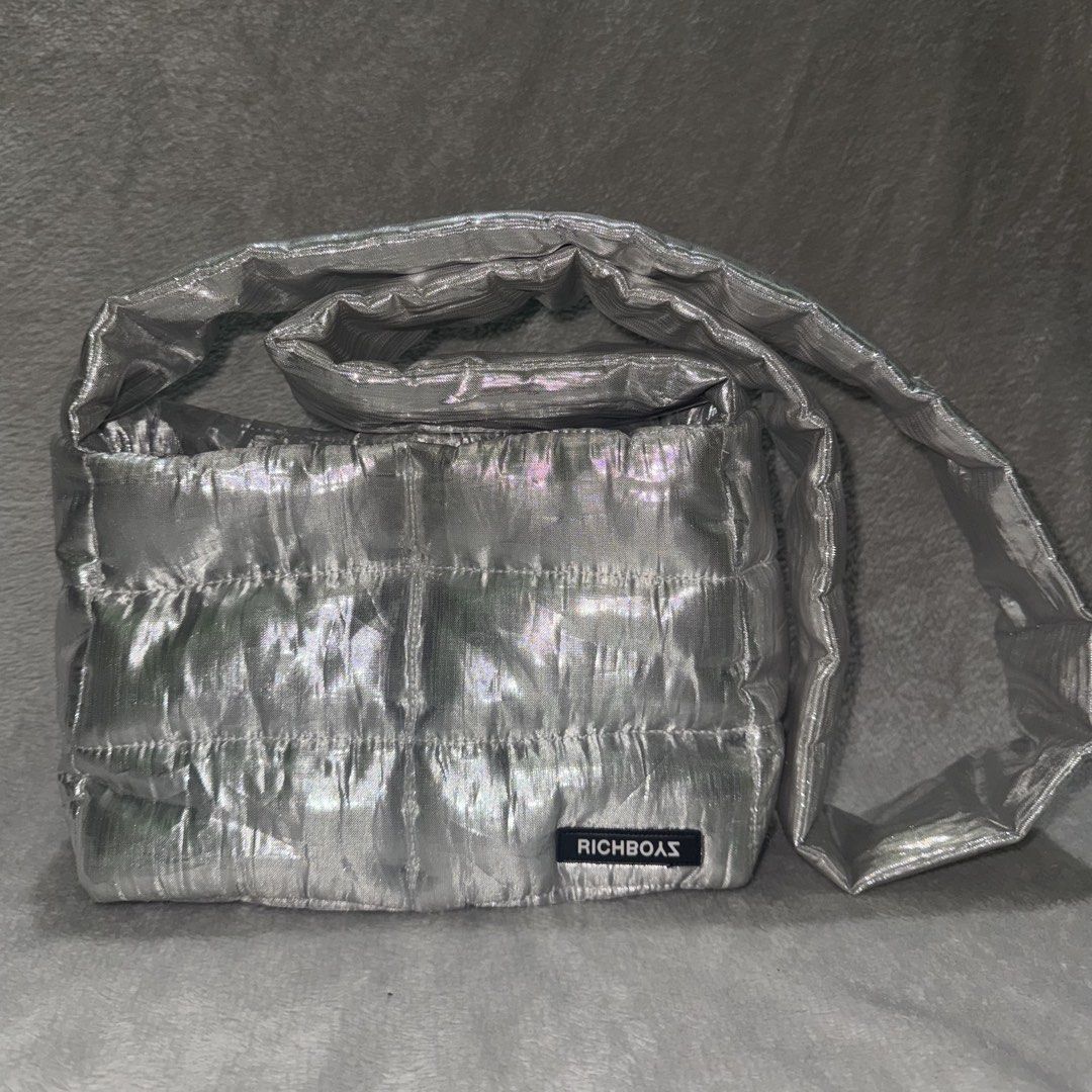 Richboyz pufferino silver (Category: Sling Bags) located in Imus. Submitted by jayymess (Listing ID 1437161613, Image 1). Description: Used 5x Di ko nagagamit kaya bebenta ko na Lumalabas lang yung filler (normal issue) .
