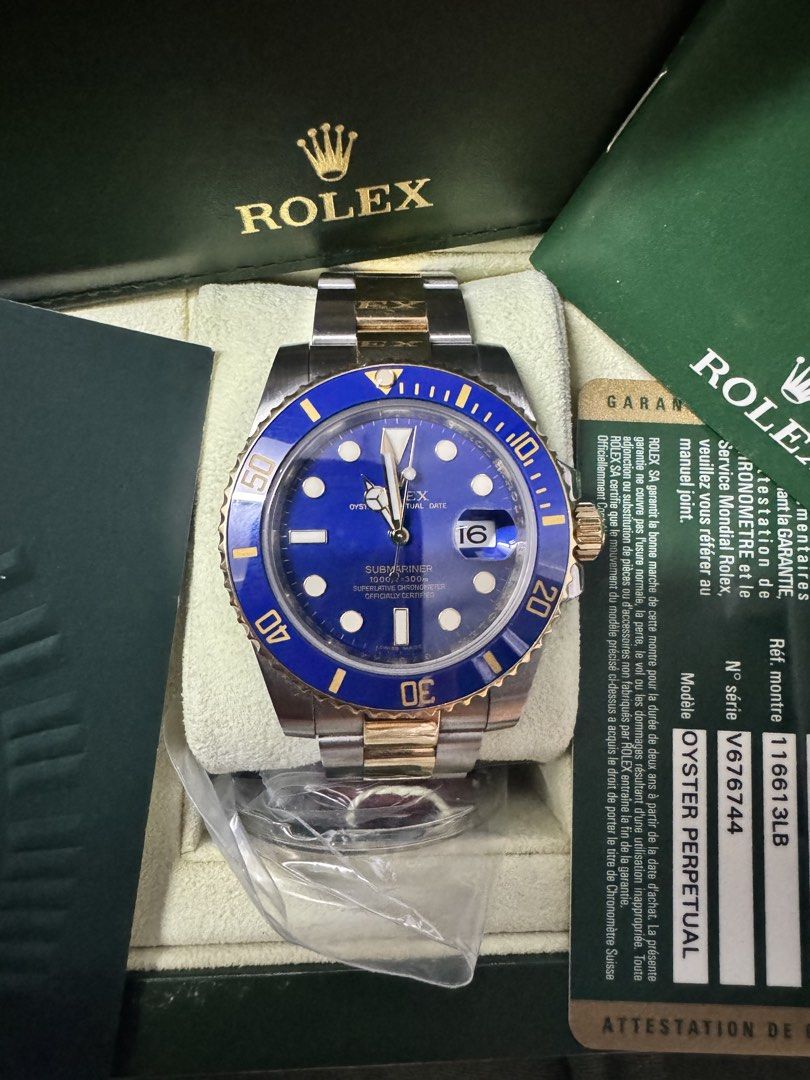Rolex Submariner Blue Dial Two-Tone (Category: Luxury Watches) located in Manila. Submitted by nash.alawiya121293 (Listing ID 1437155396, Image 2). Description: - 2010 model - Rolex Submariner - Blue dial - Two-tone stainless steel and gold bracelet - Includes original box, warranty card, and booklets - Date display - Brand new in original packaging.