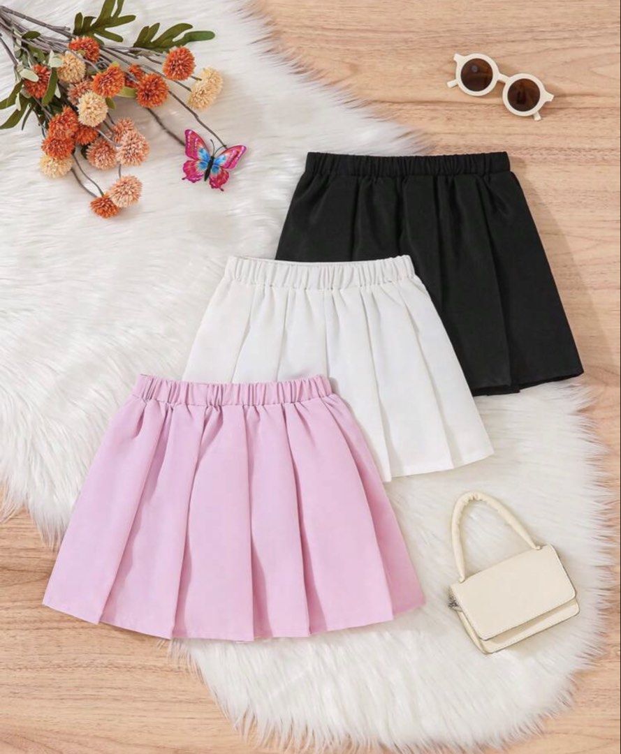 Set Pleated Skirts - Pink, White, Black (Category: Babies & Kids Fashion) located in Santo Tomas. Submitted by kylejao21 (Listing ID 1437083194, Image 2). Description: - Pleated skirts available in three colors: pink, white, and black. - Comfortable elastic waistband. - Pink skirt features a "Wild Love" graphic. - White and black skirts feature a "Love" graphic. - Perfect for casual wear..