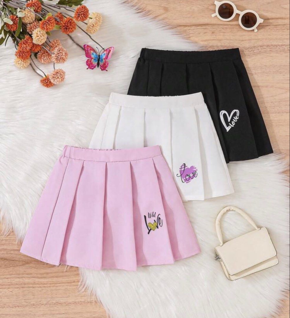 Set Pleated Skirts - Pink, White, Black (Category: Babies & Kids Fashion) located in Santo Tomas. Submitted by kylejao21 (Listing ID 1437083194, Image 1). Description: - Pleated skirts available in three colors: pink, white, and black. - Comfortable elastic waistband. - Pink skirt features a "Wild Love" graphic. - White and black skirts feature a "Love" graphic. - Perfect for casual wear..