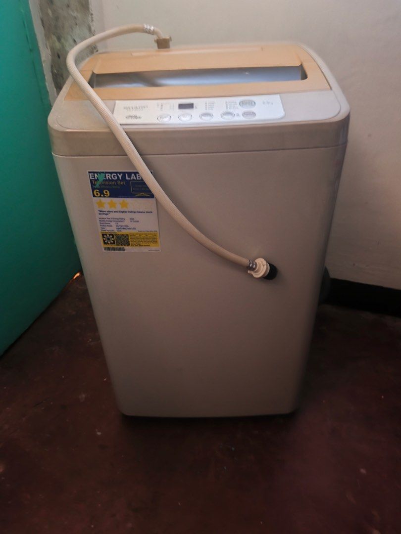 Sharp Washing Machine ES-F65GP (Category: Washing Machines and Dryers) located in Manila. Submitted by vickim0513 (Listing ID 1437104331, Image 1). Description: - Sharp washing machine with 6.5kg capacity - Auto Logic function - Multiple wash settings - Includes water inlet hose - Stylish beige and white color scheme - Digital display control panel - Energy rating: 6.9.
