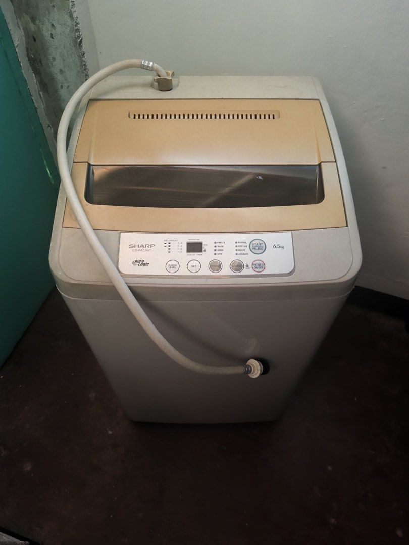 Sharp Washing Machine ES-F65GP (Category: Washing Machines and Dryers) located in Manila. Submitted by vickim0513 (Listing ID 1437104331, Image 3). Description: - Sharp washing machine with 6.5kg capacity - Auto Logic function - Multiple wash settings - Includes water inlet hose - Stylish beige and white color scheme - Digital display control panel - Energy rating: 6.9.