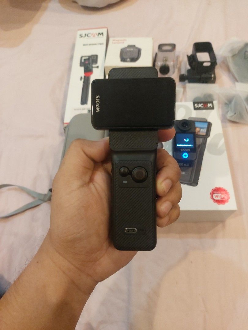 SJCAM C400 Action Camera (Category: Cameras) located in Manila. Submitted by kenriosy (Listing ID 1437160537, Image 3). Description: - SJCAM C400 action camera - Includes camera, case, selfie stick, and various mounts - Built-in screen - In good working condition - Black color - Complete with original box.