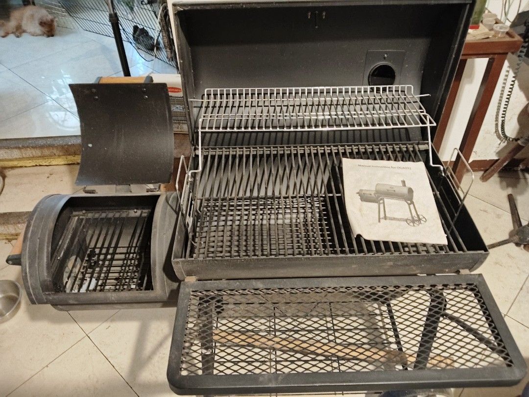 Smoker Grill with Free Grilling Tool Set (Category: BBQ, Grills & Hotpots) located in Manila. Submitted by cooltree-540c (Listing ID 1437072140, Image 1). Description: - Smoker grill with free 17-piece grilling tool set. - Features a built-in thermometer for precise temperature control. - Includes a convenient side firebox. - Offers a large cooking surface and a warming rack. - Comes with a storage case for the grilling tools. (Grilling tool set)