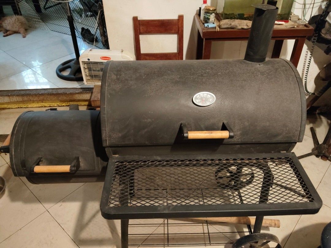 Smoker Grill with Free Grilling Tool Set (Category: BBQ, Grills & Hotpots) located in Manila. Submitted by cooltree-540c (Listing ID 1437072140, Image 2). Description: - Smoker grill with free 17-piece grilling tool set. - Features a built-in thermometer for precise temperature control. - Includes a convenient side firebox. - Offers a large cooking surface and a warming rack. - Comes with a storage case for the grilling tools. (Grilling tool set)