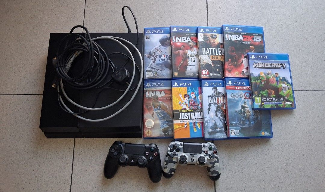 Sony PlayStation 4 Console with Games and Controllers (Category: PlayStation) located in Manila. Submitted by 88888av (Listing ID 1437122651, Image 1). Description: - PlayStation 4 console - Two DualShock 4 controllers (black and camouflage) - Game discs: NBA 2K16, Minecraft, Just Dance, and gods of war ,etc - Includes power charger and HDMI cables - RFS not using anymore/ decluttering price is still negotiable pick up shoulder by buyer.