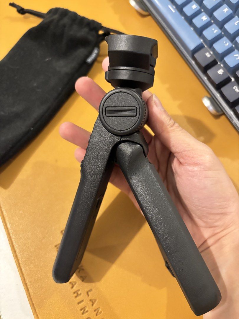 Sony Wireless Shooting Grip (Category: Tripods & Monopods) located in Manila. Submitted by annadelprado14 (Listing ID 1437161420, Image 2). Description: - Sony GP-VPT2BT shooting grip - Functions as both a tripod and remote control - Features photo and movie recording buttons - Includes zoom control - Lock function for secure setup - Can be used handheld or as a tripod - Comes with a carrying pouch.