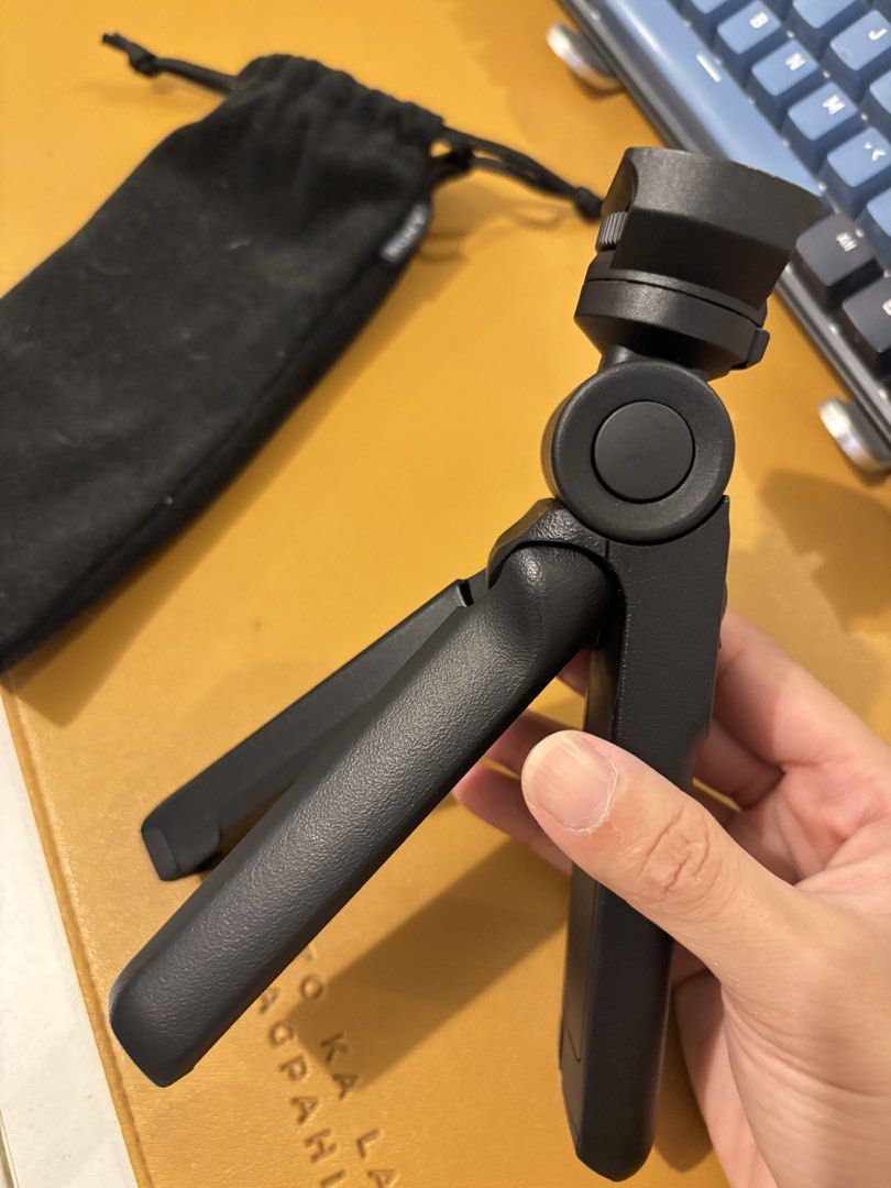 Sony Wireless Shooting Grip (Category: Tripods & Monopods) located in Manila. Submitted by annadelprado14 (Listing ID 1437161420, Image 3). Description: - Sony GP-VPT2BT shooting grip - Functions as both a tripod and remote control - Features photo and movie recording buttons - Includes zoom control - Lock function for secure setup - Can be used handheld or as a tripod - Comes with a carrying pouch.