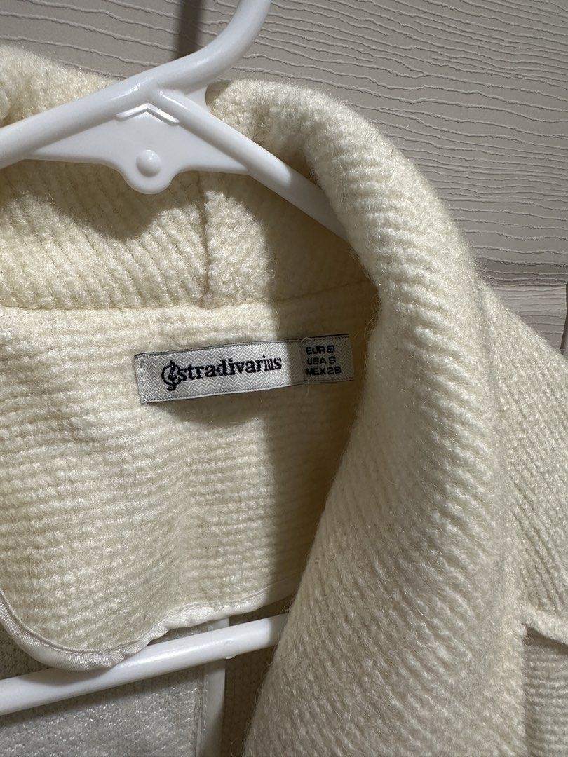Stradivarius Cream White Trench Coat (Category: Coats, Jackets and Outerwear) located in Manila. Submitted by pmrshops1 (Listing ID 1437063793, Image 3). Description: - Stradivarius cream coat - Size: S - Features a shawl collar - Two front pockets - Textured fabric - Longline design - Great for layering - Versatile style.